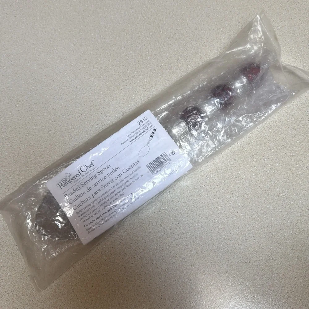 The Pampered Chef Stainless Steel Spoon with Red Accents